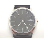 Skagen Denmark slimline black faced gents wristwatch in stainless steel case on a genuine Skagen