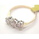 14ct gold three stone ring size R 2.