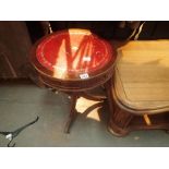 Drum head table with four faux and two real drawers leather panel top on castors 59 x 61 cm