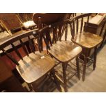 Three wooden bar stools and a bureau