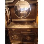 Large antique sideboard with circular mirror