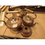 Two copper kettles a brass example and a posser