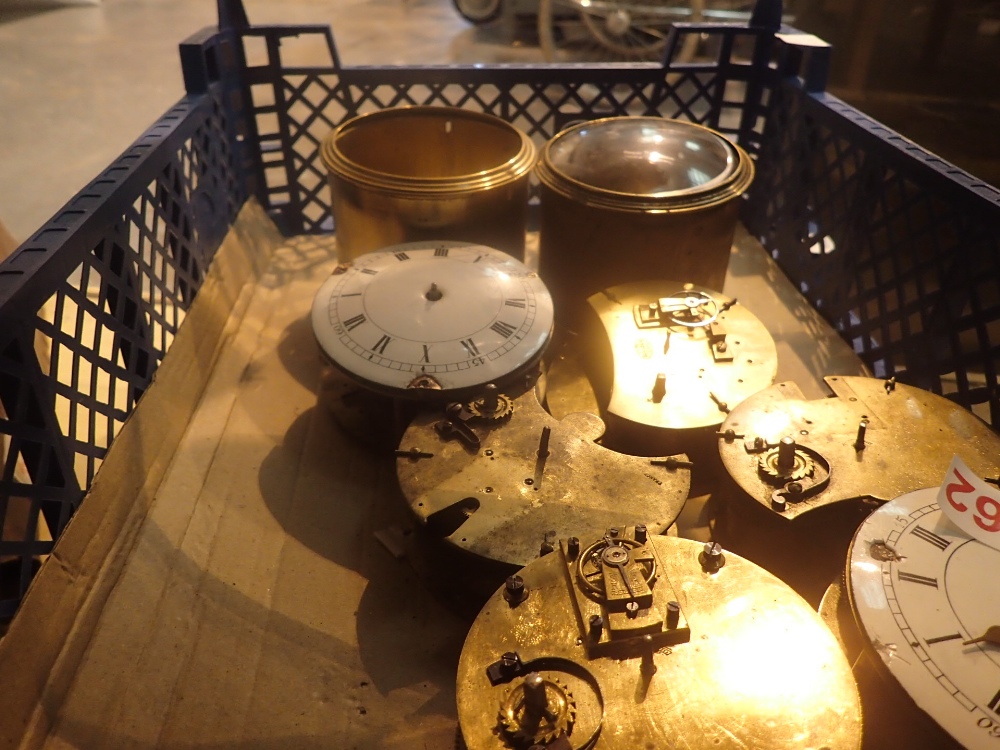 Two trays of clock parts