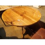 Circular pine kitchen table and a dressing table stool