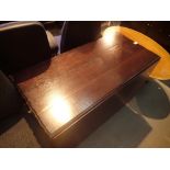 Large mahogany drop leaf table and an oval coffee table