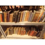 Two shelves of Mid Century books mainly military and fiction