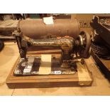 Hand cranked Singer sewing machine in case