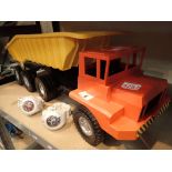 Large plastic articulated lorry and two