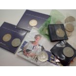 Two packaged £5 coins seven further £5 c