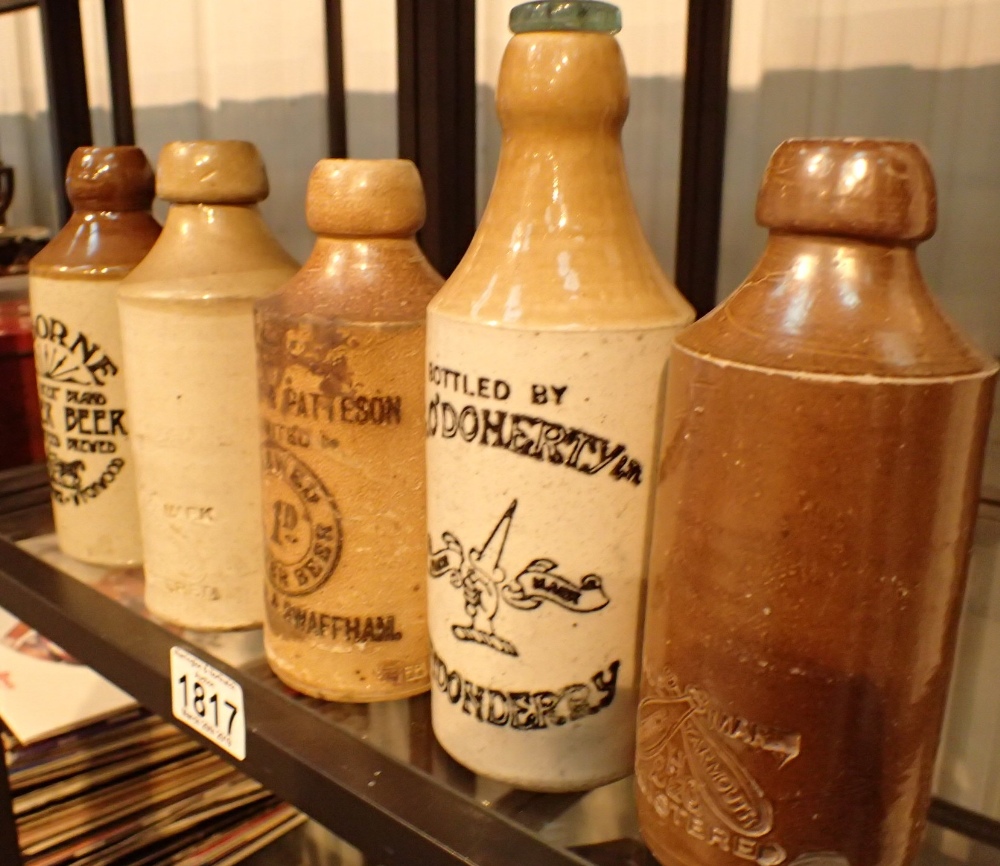 Five mixed ginger beer bottles including