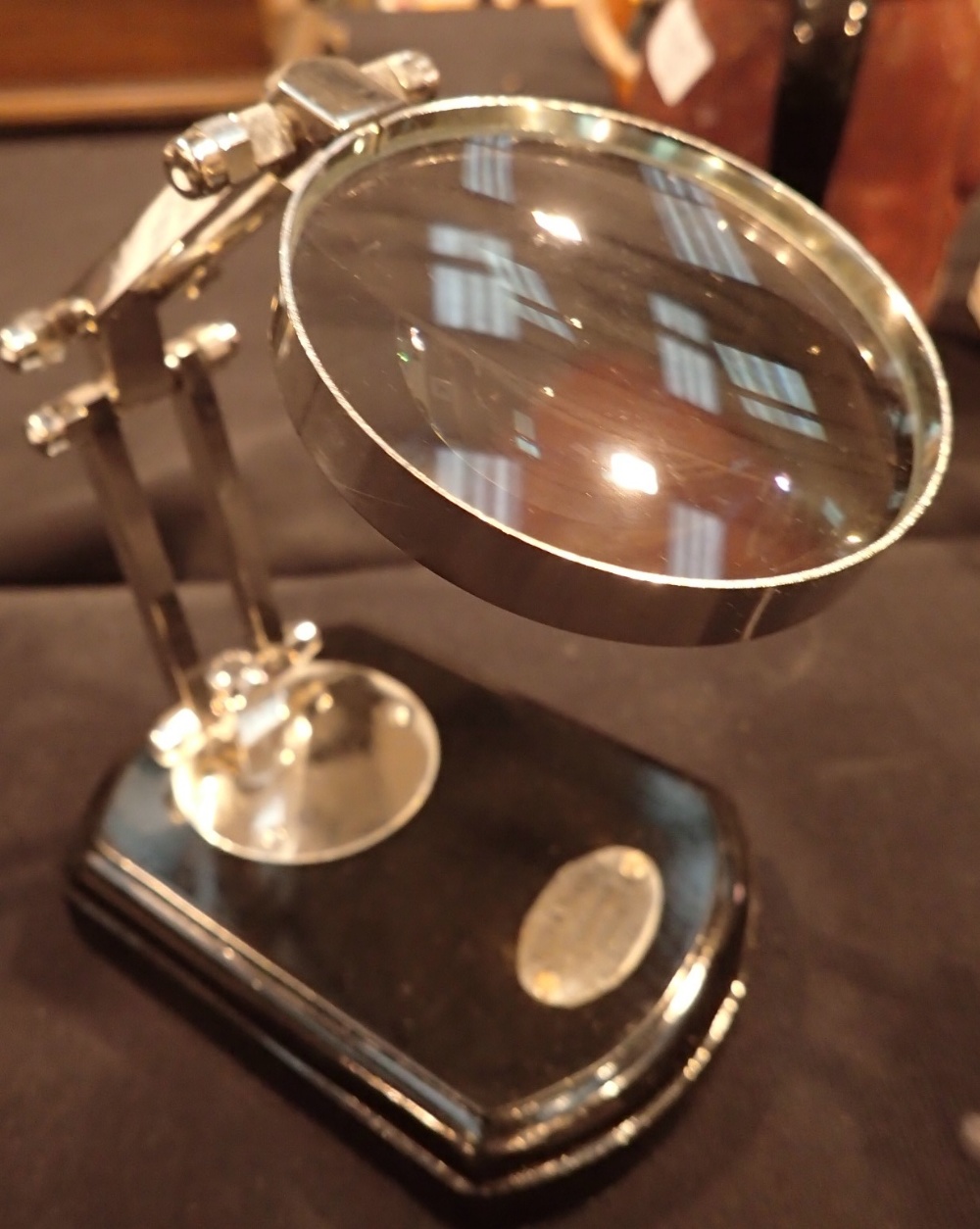 Magnifying glass on wooden base