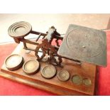 Antique brass 4 oz balance scales with four weights