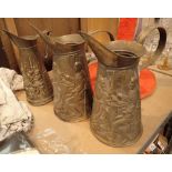 Three brass jugs