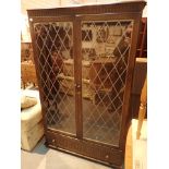 Large double leaded glazed door display cabinet with under drawer