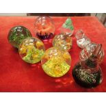 Nine mixed glass paperweights