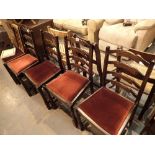 Set of four ladderback dining chairs with upholstered seats and a further chair