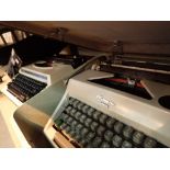 Two vintage typewriters Olympic Monica and Brother Electric 3600