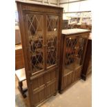 Two Priory style display cabinets both with leaded glass doors