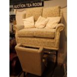 Two seat upholstered settee and an upholstered armchair