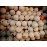 Box of used practice golf balls