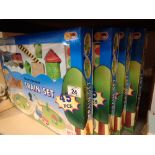 Four wooden train sets boxed with battery operated engine