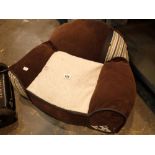 Mini dog bed in the shape of a chair with Gromit to one arm front