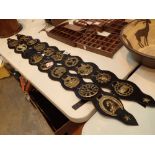 Two leather decorative martingales with 18 horse brasses