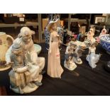 Five Nao figurines clown and apprentice three children with animals and a lady with flowers