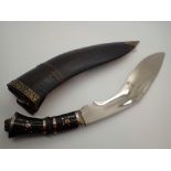 Leather sheathed kukri skinning knife