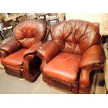 Pair of burgundy red leather armchairs