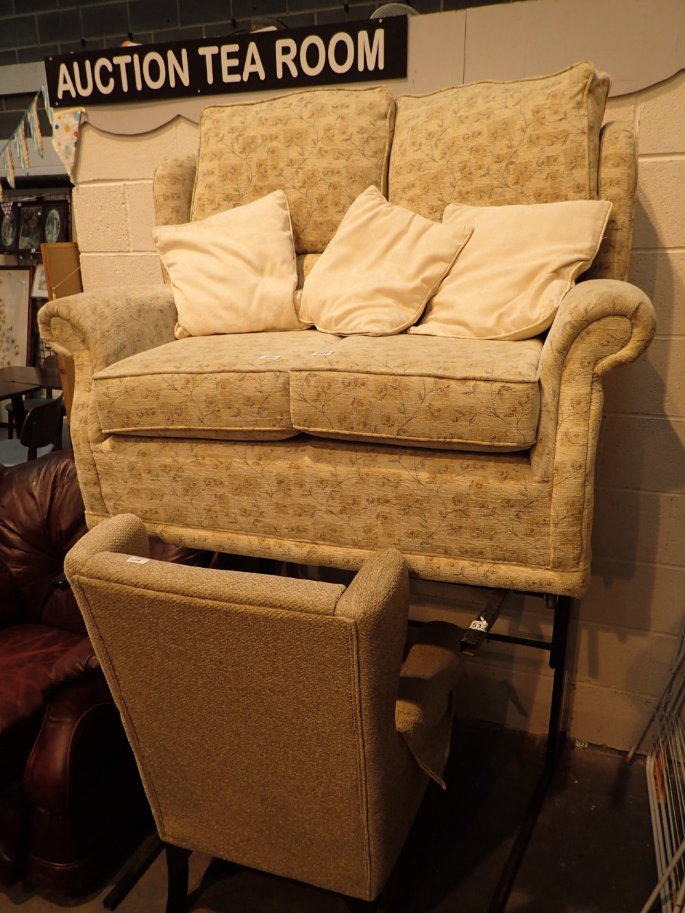 Two seat upholstered settee and an uphol