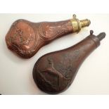Two copper and brass antique powder flasks with dog and game decoration