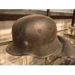 Period German helmet with neck guard and liner