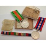 Two WWII medals in box of issue with ribbon bar to T A Quinn