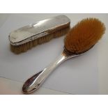 Two silver brushes