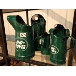 Five Land Rover oil cans