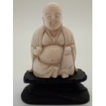 Oriental carved bone Buddha figurine