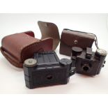 Side Extra miniature camera with case and a Univex Model A camera with case