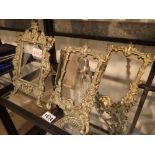 Four brass picture frames including a pair