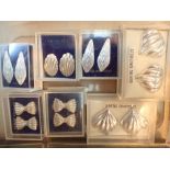 Seven pairs of sterling silver earrings