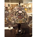 Large Tiffany style twin bulb lamp on a metal base CONDITION REPORT: The electrical