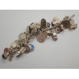 Heavy silver charm bracelet ( not all charms may be silver ) 160g