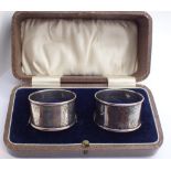 Pair of boxed hallmarked silver napkin rings with vacant cartouche