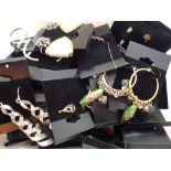 Box of new costume jewellery earrings including silver