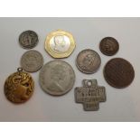 Mixed coins and a 1965 rabies vacination token