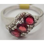 Silver garnet set three stone ring size P