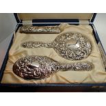 Boxed four piece silver backed dressing table set bird and mask design HM Birmingham 1978 Broadway