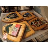 Tray of eight military related badges on shields