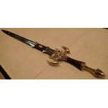 Reproduction steel and brass fantasy sword with dragon guard and wrapped leather handle blade