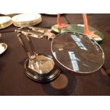 Chrome magnifying glass on a wooden base
